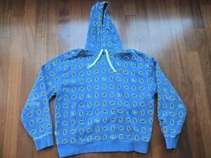 Lacoste Blue Hoodie with Yellow & Black Logo Pattern